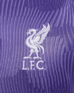 Liverpool FC third jersey 2023/24 with purple color and club crest.
