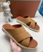 Casual brown slide sandals with wide straps, perfect for summer wear.