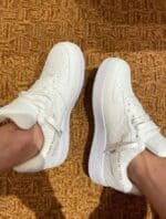 Authentic LV x Nike Air Force 1 Low sneakers in white with designer details.