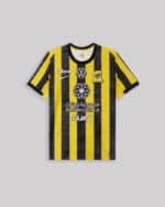 Official Al-Ittihad home player jersey for 2025/26 season, yellow and black striped design.