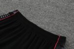 Man City 2022/23 training set with black shorts and red accents. Perfect for fans and players.