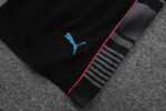 Close-up of Manchester City training jersey with Puma logo and design details.