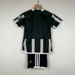 Kids away football kit Manchester United 2023/24.