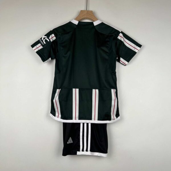 Kids away football kit Manchester United 2023/24.