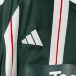 Kids Manchester United away football kit 2023/24 with team logo and design details.