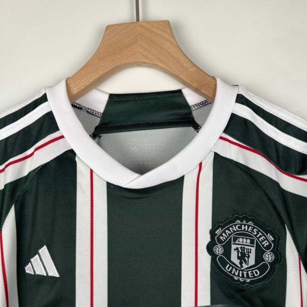 Official Manchester United away football kit for kids 2023/24 season.
