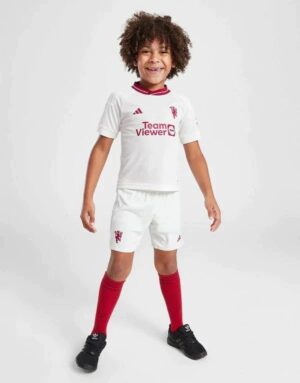 Manchester United third kit for kids 2023/24 featuring the iconic red and white design.