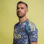 AJX Away jersey 2024/25 with team logo and vibrant design.