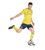 Player in yellow AL Nassr football jersey kicking ball.