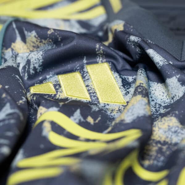 AJX Away jersey 2024/25 with bold yellow and black design, perfect for football fans.