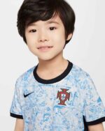 Kids wearing Portugal away football kit 2024, youth soccer jersey for young players.