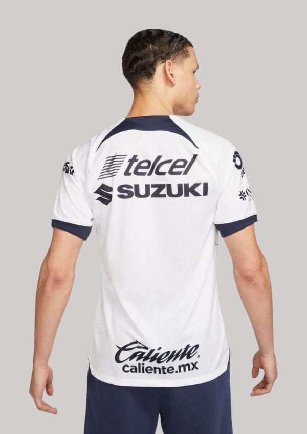 Pumas UNAM 2023/24 home football jersey with sponsor logos.