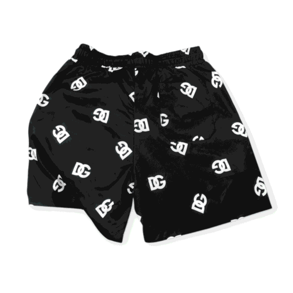 Black swim shorts with DG logo print for men. Comfortable, stylish, perfect for beach or pool activi.