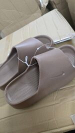 Nike Calm Slide in khaki color, comfortable slip-on footwear for casual wear.