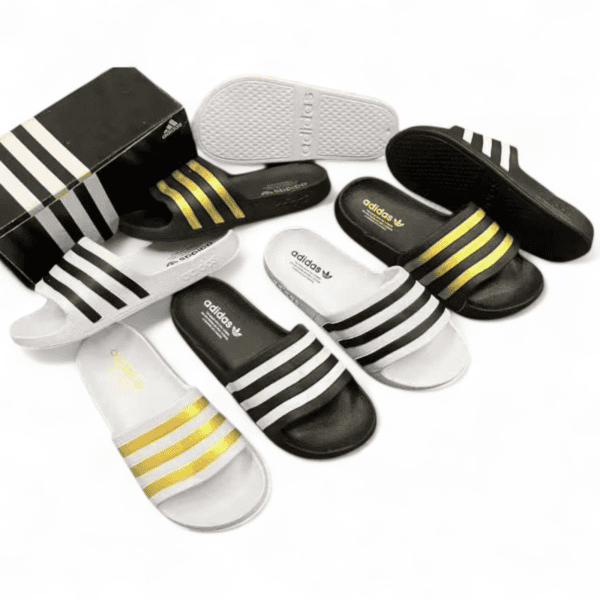 Comfortable Adidas slide sandals with iconic stripe design. Perfect for casual wear and beach outing.