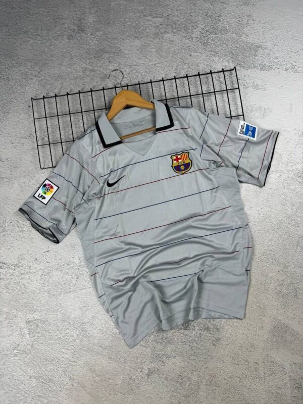 Official FC Barcelona 2023 home football jersey with Ronaldinho 10, authentic match-worn kit.