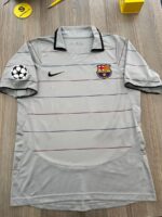 Barcelona FC UEFA Champions League home jersey with Nike logo and team crest.