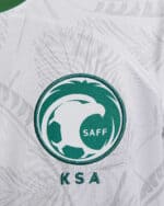Soccer ball logo featuring KSA emblem and "SAFF" text, representing Saudi Arabian football federatio.