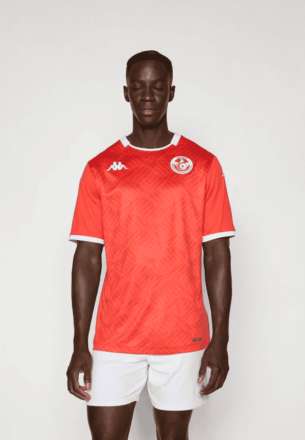 Tunisian football jersey with team logo and Kappa branding, perfect for fans and players.