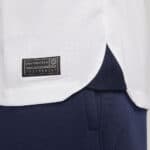 Close-up of Pumas 2023/24 home football jersey fabric and tag detail.