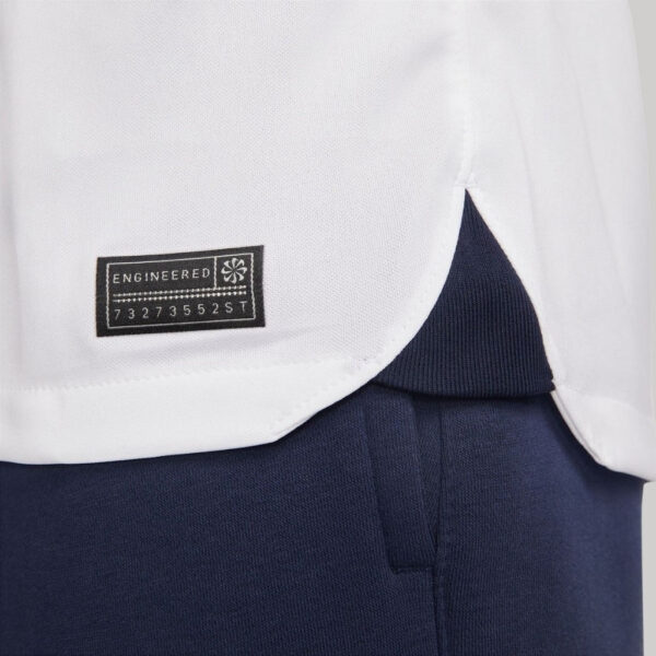 Close-up of Pumas 2023/24 home football jersey fabric and tag detail.