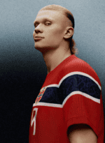 Portrait of a male athlete in a red jersey with the number 7, facing left with a confident expression; Norway crest on the chest and a dark gradient background.
