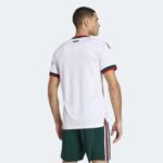 Mexico away football jersey for World Cup 2026, white with red and green accents.