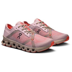 Pair of pink running shoes with gray overlays and beige laces, featuring a cushioned beige sole and orange accents on the outsole.