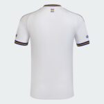Back view of a white polo shirt on a mannequin, with blue and yellow collar and sleeve trim and small text at the neck area