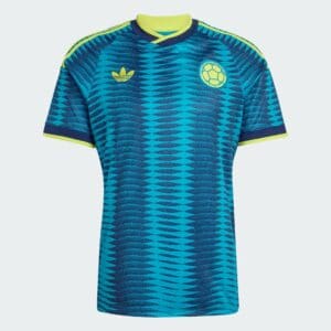 Turquoise and blue football jersey with a wavy pattern, yellow trim, and the Colombia national team crest on the chest.