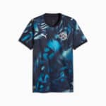 Blue tie-dye football jersey with short sleeves, Puma logos on chest and sleeves, and a circular club crest on the left chest.