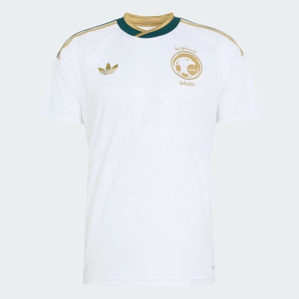 White Saudi national football jersey with gold accents, Adidas logo, and SAFF crest on the chest