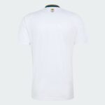 Back view of a white polo shirt with a small gold emblem at the upper back near the collar, on a light gray background.