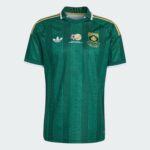 Green striped soccer jersey with white collar, Adidas logo, SAFA crest, and gold shoulder stripes on chest area