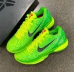 Bright green Nike Kobe 6 Protro Grinch basketball shoes with black Nike swoosh and yellow accents.