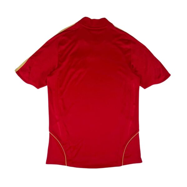 Spain national team home football jersey 2008/10, red with gold accents.