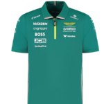 teal polo shirt featuring numerous sponsor logos (Aramco, Cognizant, Boss, JCB, SentinelOne) with Aston Martin wings emblem and a yellow zipper detail on the chest.