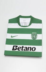 Folded green-and-white striped soccer jersey with Betano sponsor and SCP Sporting Portugal crest, Nike logo on chest.