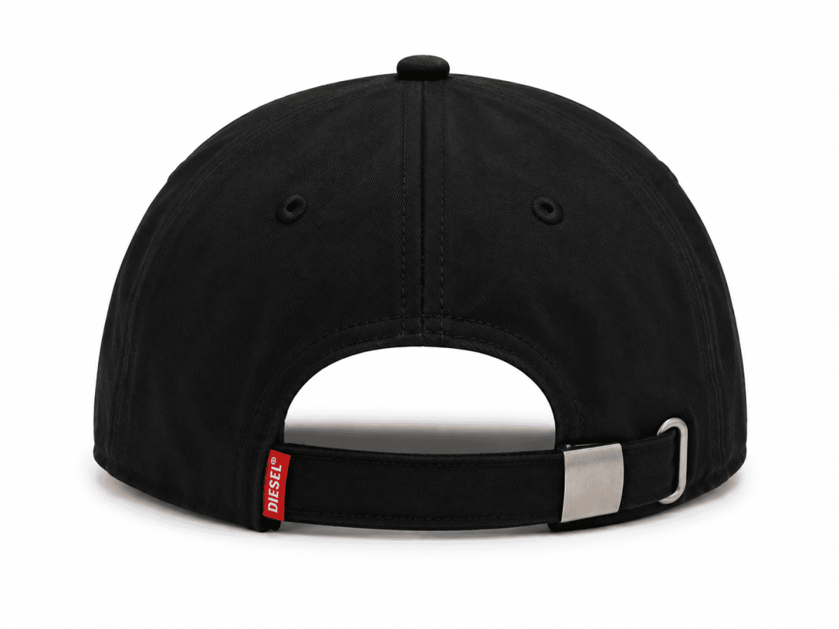 Rear view of a black baseball cap with an adjustable strap and metal buckle; small red Diesel tag visible near strap edge.