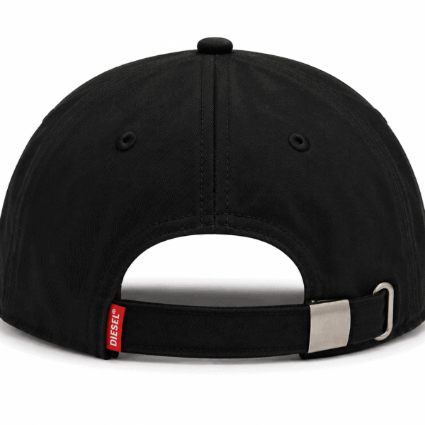 Rear view of a black baseball cap with an adjustable strap and metal buckle; small red Diesel tag visible near strap edge.
