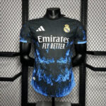 Real Madrid football jersey on a mannequin, dark with blue splash pattern, Emirates Fly Better sponsor and club crest on chest, Adidas logo