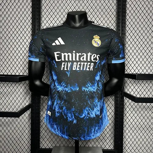 Real Madrid football jersey on a mannequin, dark with blue splash pattern, Emirates Fly Better sponsor and club crest on chest, Adidas logo