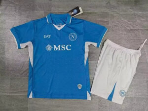 01a779_52c553a8da454bb29e0aece1e0ac530a_mv2 | UAE SPORT STORE Blue Napoli football jersey with white trim and MSC sponsor, laid out beside matching white shorts featuring the Napoli crest.