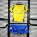 01a779_65eb682260164ae8b192e5e2bad208d3_mv2 | UAE SPORT STORE Yellow soccer jersey with blue accents on a hanger above royal blue shorts; jersey shows club crest, Adidas logo, and sponsor text 'KAFD'.