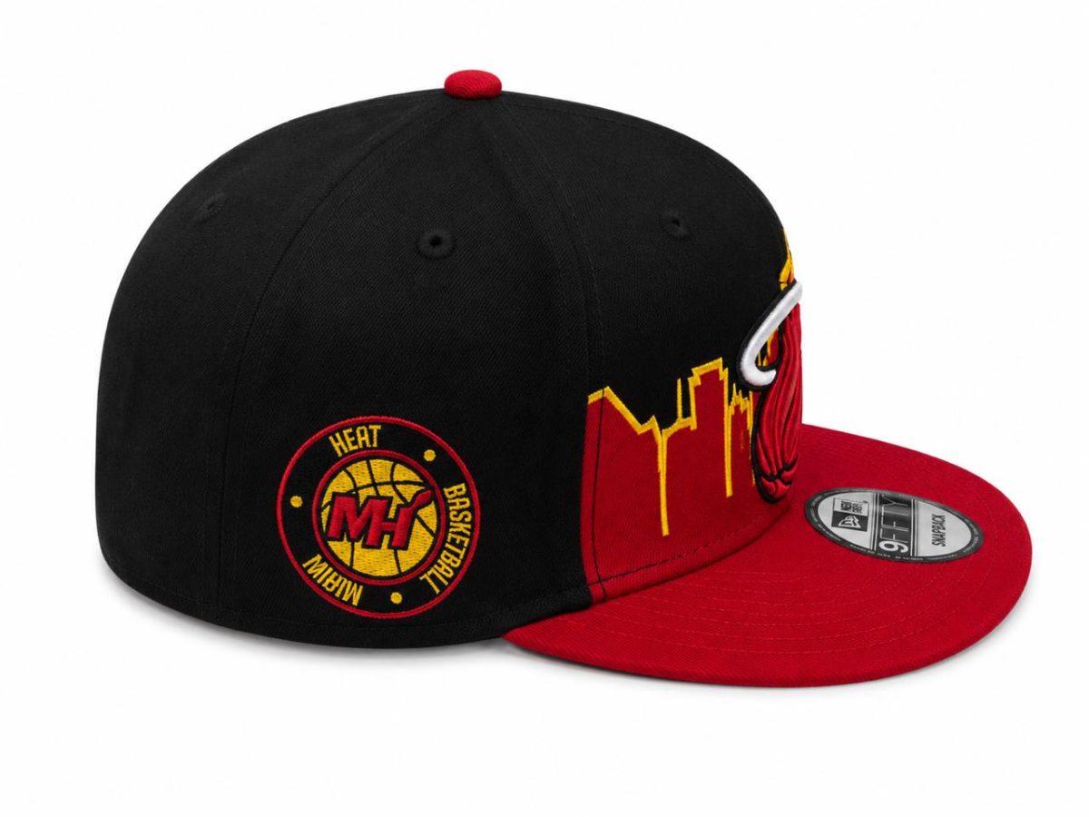Black crown and red brim basketball cap with a circular Heat Basketball patch on the side and a yellow skyline embroidery along the brim side.