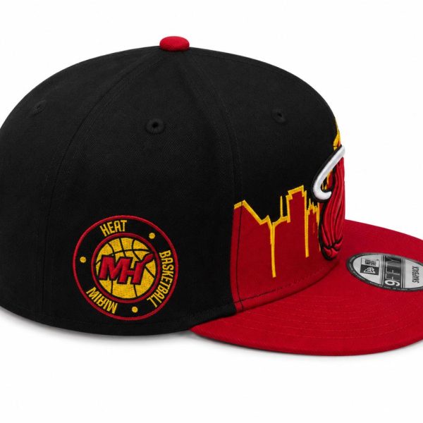 Black crown and red brim basketball cap with a circular Heat Basketball patch on the side and a yellow skyline embroidery along the brim side.