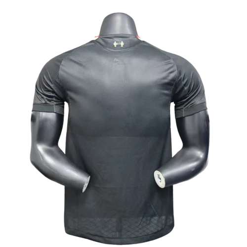 Back view of a black athletic compression shirt on a torso mannequin, with short sleeves and mesh-like lower back panel