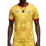 Yellow soccer jersey with red collar and cuffs, geometric pattern, Ghana crest on the chest.
