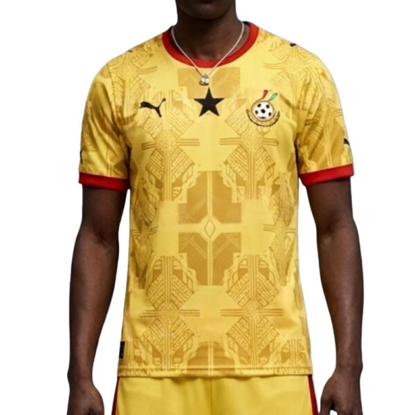 Yellow soccer jersey with red collar and cuffs, geometric pattern, Ghana crest on the chest.