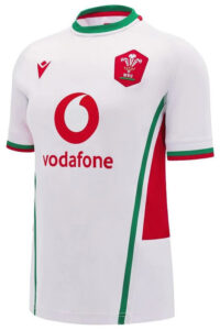 White Wales rugby jersey with Vodafone sponsor, WRU crest, and red/green trim on sleeves and sides.